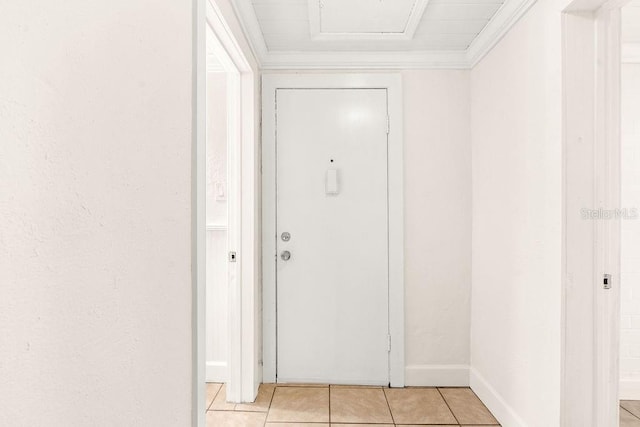 interior space featuring light tile patterned floors and crown molding