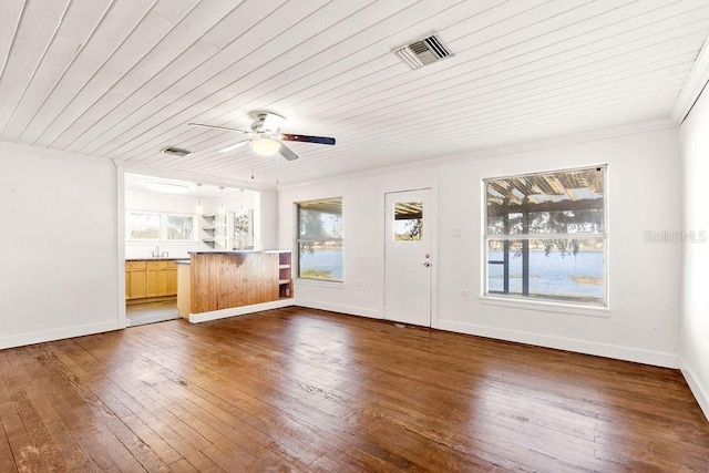 interior space featuring ceiling fan, sink, and wooden ceiling