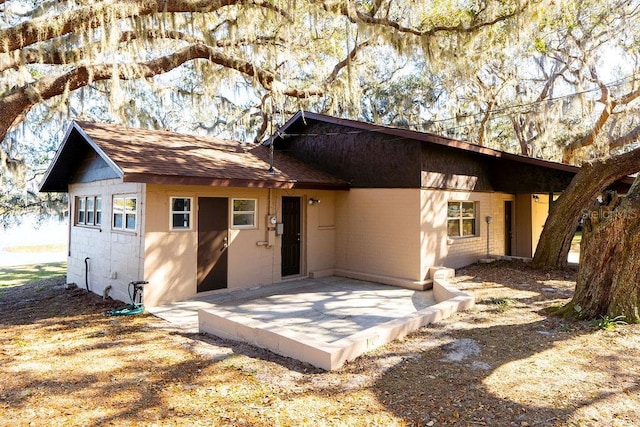 back of property featuring a patio area