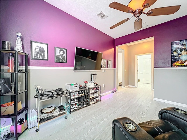 interior space with ceiling fan and light hardwood / wood-style flooring