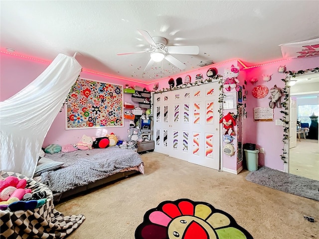 carpeted bedroom featuring ceiling fan