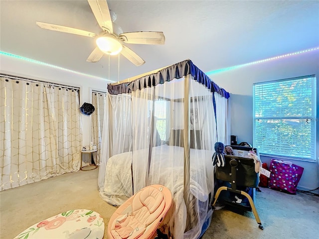 bedroom with ceiling fan and carpet