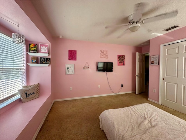 carpeted bedroom featuring ceiling fan