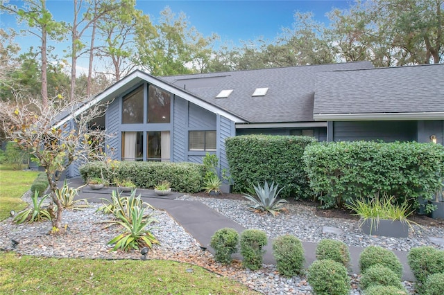 view of front of house with roof with shingles