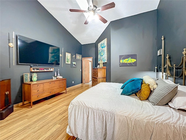 bedroom with lofted ceiling, ceiling fan, and wood finished floors