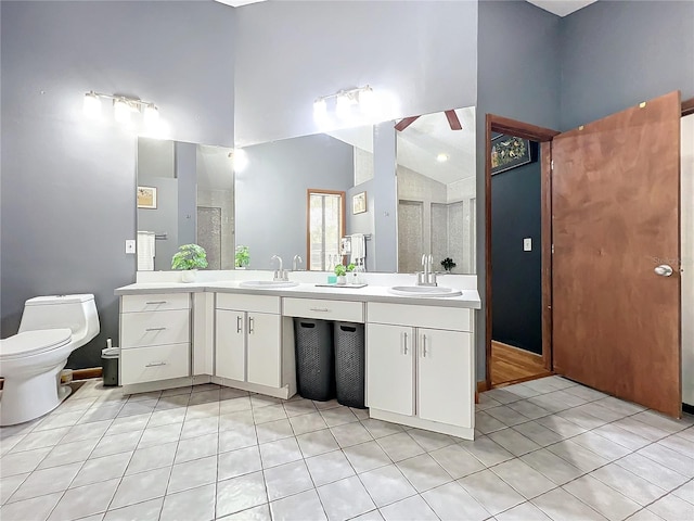 full bath with tile patterned flooring, a sink, a shower stall, and double vanity