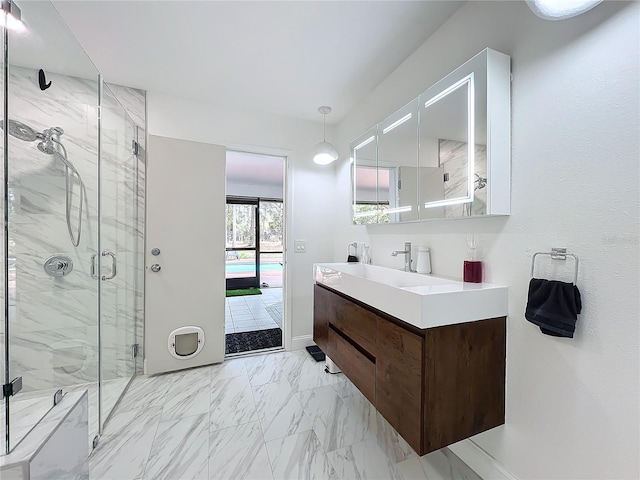 full bath featuring marble finish floor, connected bathroom, vanity, and a marble finish shower