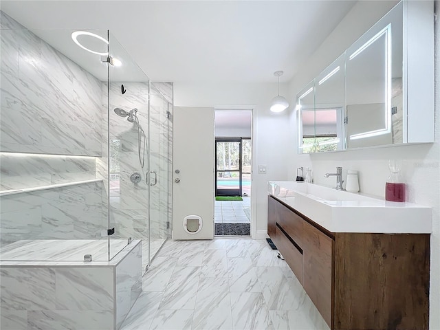 full bathroom with marble finish floor, a marble finish shower, and vanity