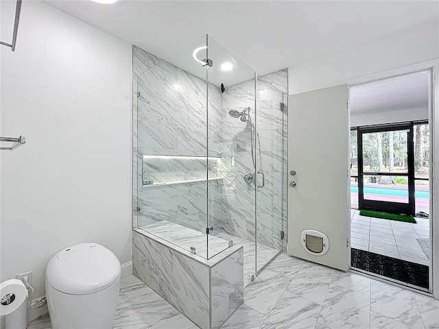 full bath featuring marble finish floor and a marble finish shower