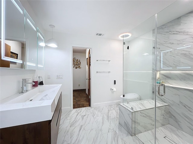 full bath with a marble finish shower, baseboards, visible vents, marble finish floor, and vanity