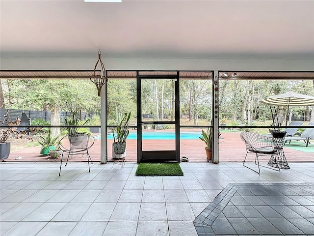 unfurnished sunroom featuring plenty of natural light