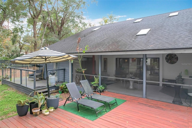 deck with a sunroom