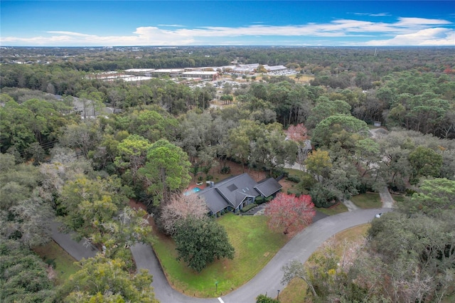 drone / aerial view featuring a forest view