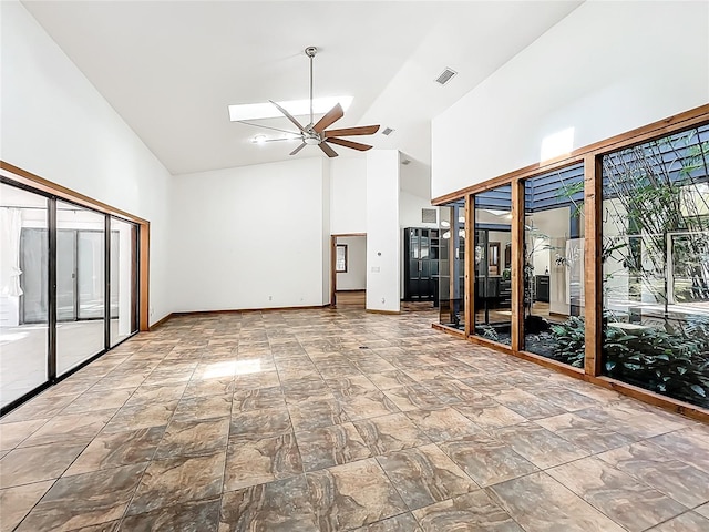 1701 Cedar Stone Ct, Lake Mary, FL 32746 - unfurnished living room featuring high vaulted ceiling, ceiling fan, baseboards, and stone finish floors