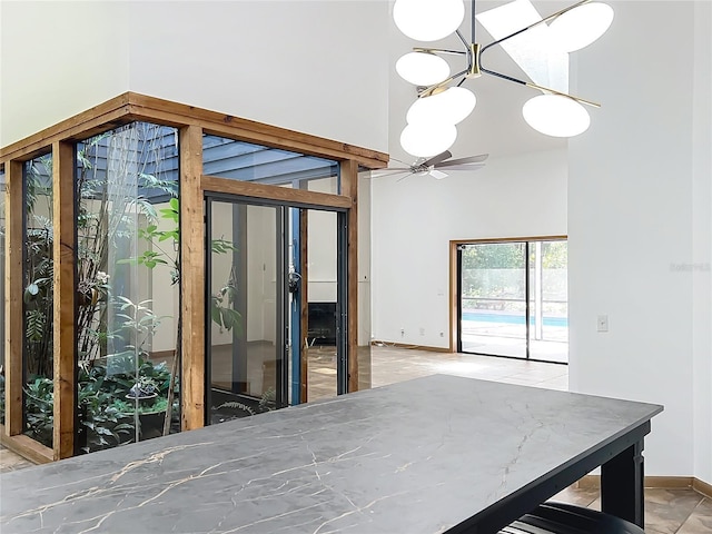 1701 Cedar Stone Ct, Lake Mary, FL 32746 - dining room with a towering ceiling, baseboards, and ceiling fan