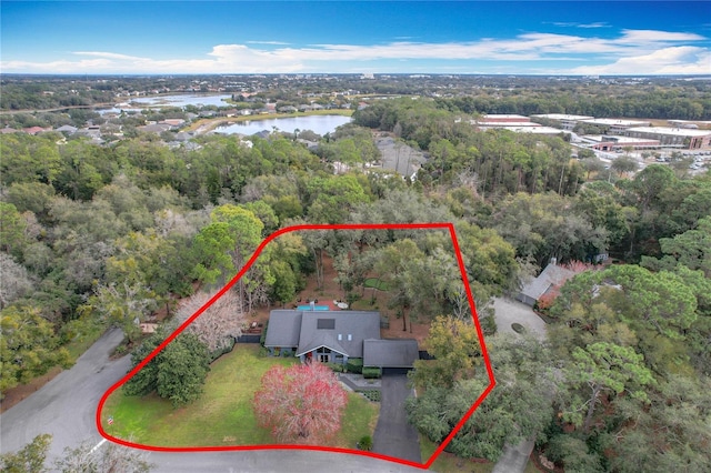 1701 Cedar Stone Ct, Lake Mary, FL 32746 - aerial overview of property's location with a nearby body of water, property boundaries highlighted, and a heavily wooded area