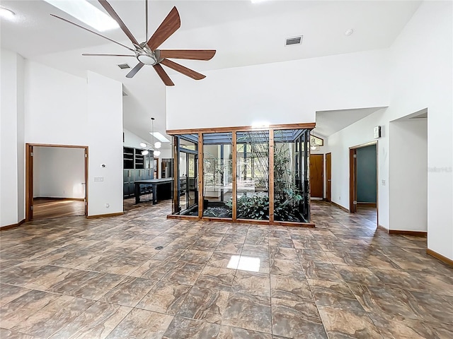 1701 Cedar Stone Ct, Lake Mary, FL 32746 - unfurnished living room featuring high vaulted ceiling, baseboards, ceiling fan, and a chandelier