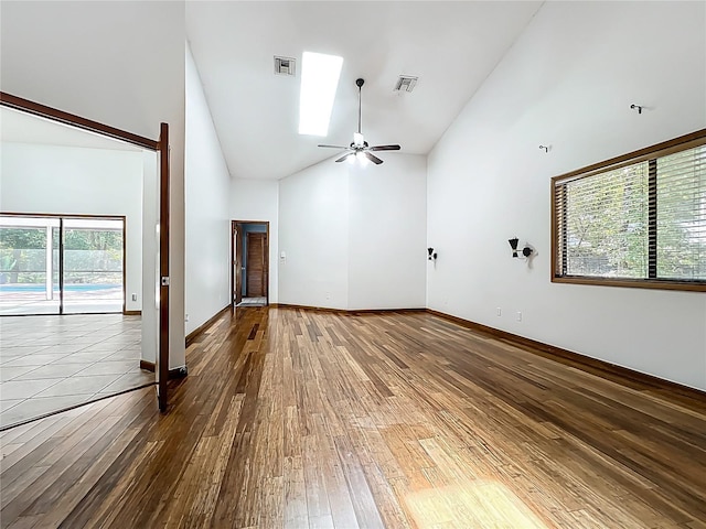1701 Cedar Stone Ct, Lake Mary, FL 32746 - empty room featuring high vaulted ceiling, hardwood / wood-style flooring, ceiling fan, and baseboards