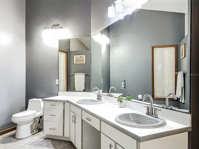 1701 Cedar Stone Ct, Lake Mary, FL 32746 - bathroom featuring double vanity, toilet, tile patterned floors, and baseboards