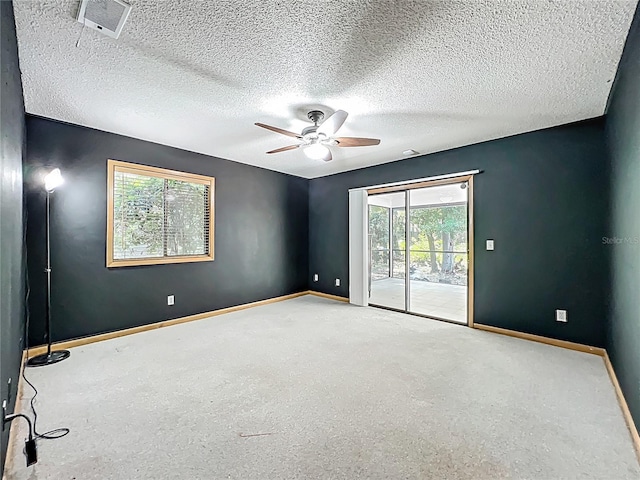 1701 Cedar Stone Ct, Lake Mary, FL 32746 - carpeted spare room featuring a ceiling fan, baseboards, and a textured ceiling
