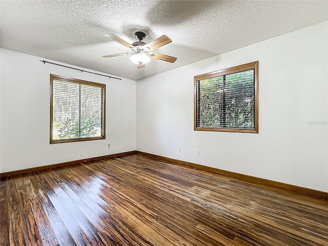 1701 Cedar Stone Ct, Lake Mary, FL 32746 - spare room featuring healthy amount of natural light, hardwood / wood-style flooring, ceiling fan, a textured ceiling, and baseboards