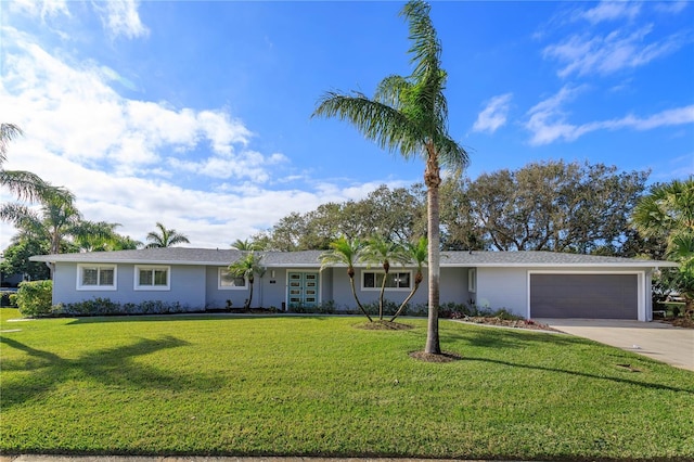 ranch-style home with a front lawn and a garage