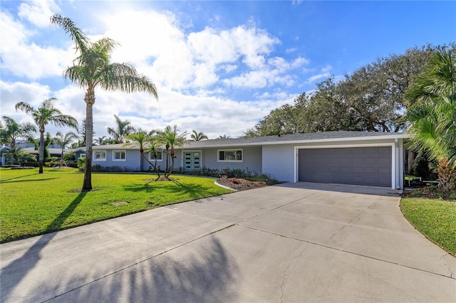 single story home featuring a front yard and a garage