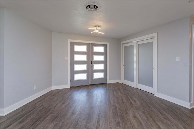 entryway featuring french doors and dark hardwood / wood-style floors