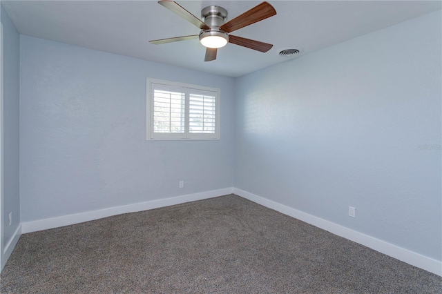 empty room with ceiling fan and carpet