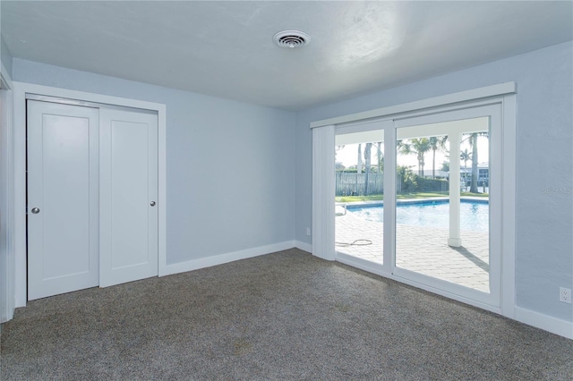 empty room featuring carpet flooring