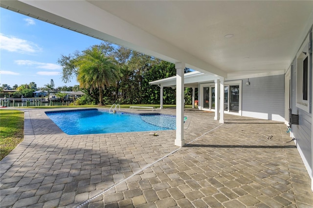 view of swimming pool with a patio