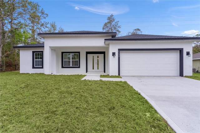 view of front facade featuring driveway, a front lawn, an attached garage, and stucco siding