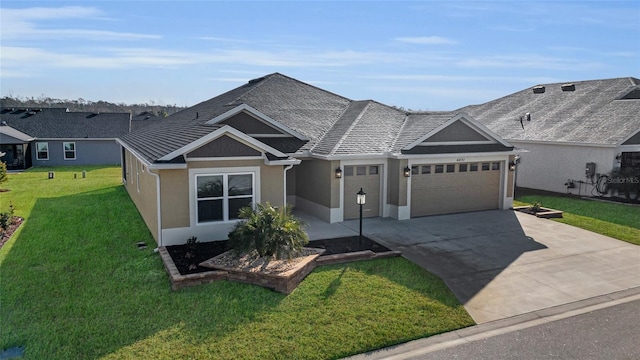 view of front of home with a garage and a front lawn