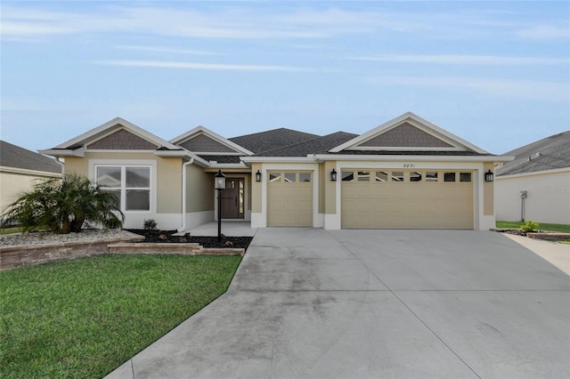 ranch-style home featuring a garage and a front lawn