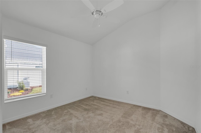 carpeted spare room with lofted ceiling and ceiling fan