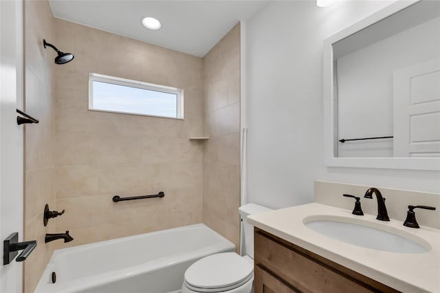 full bathroom with vanity, toilet, and tiled shower / bath