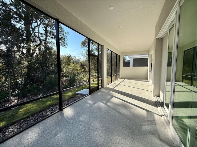 unfurnished sunroom featuring plenty of natural light