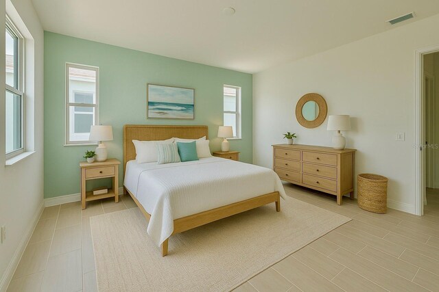 2022 Wallingford Loop, Mount Dora, FL 32757 - bedroom with multiple windows and baseboards