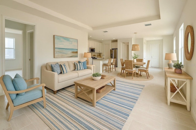 2022 Wallingford Loop, Mount Dora, FL 32757 - living area with light tile patterned floors, baseboards, and recessed lighting