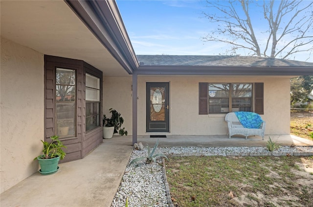 property entrance with covered porch