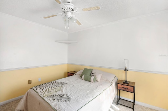 bedroom featuring ceiling fan, crown molding, and light carpet