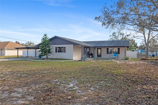 single story home featuring a front yard