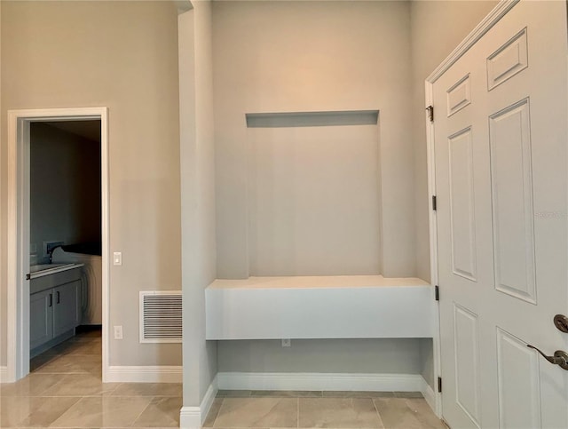 interior space featuring light tile patterned flooring