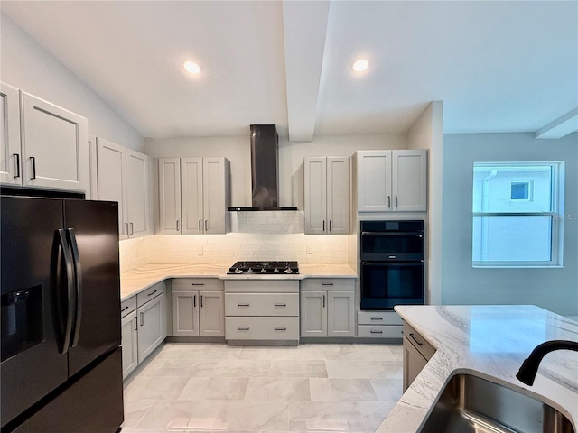 kitchen with backsplash, wall chimney range hood, sink, black appliances, and gray cabinets