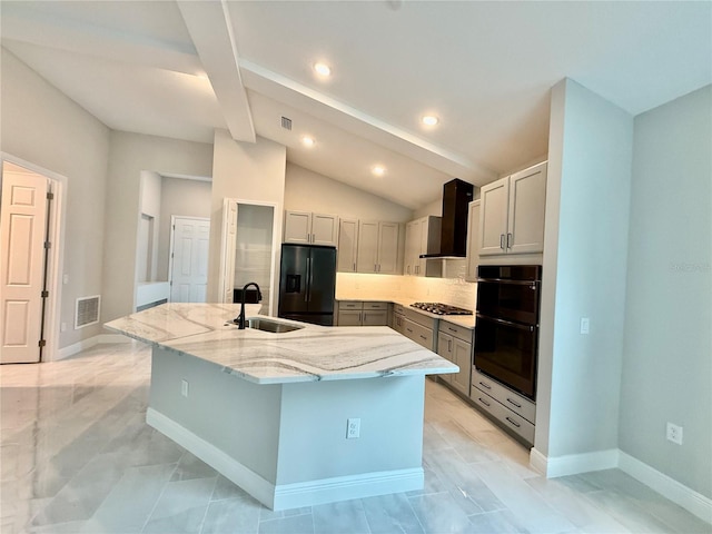 kitchen featuring gray cabinets, black appliances, wall chimney exhaust hood, and an island with sink