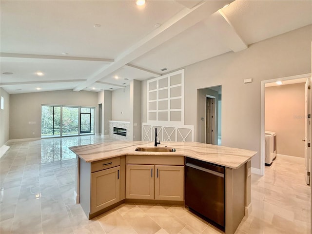 kitchen with sink, stainless steel dishwasher, vaulted ceiling with beams, light stone countertops, and washing machine and clothes dryer