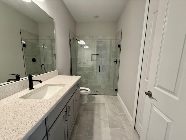 bathroom featuring tile patterned flooring, vanity, toilet, and a shower with shower door