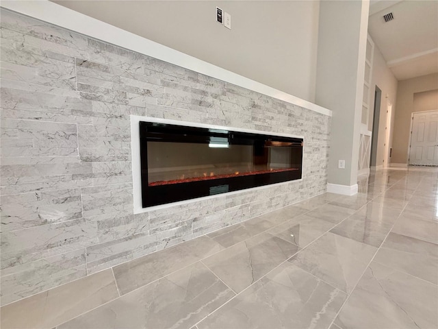 room details featuring a tiled fireplace