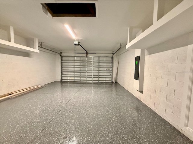 garage featuring electric panel and a garage door opener