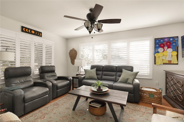 living room featuring ceiling fan, a healthy amount of sunlight, and light hardwood / wood-style flooring